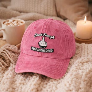 May include: A set of three ceramic mugs with a speckled, matte finish. The mugs are in shades of cream, gray, and black. Each mug has a simple, minimalist design, perfect for coffee or tea. The mugs are stacked on top of each other.