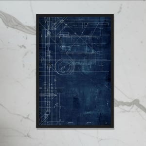 May include: Framed architectural blueprint art print. The print shows a detailed white line drawing of building plans against a dark blue background. The artwork is encased in a black frame, creating a striking contrast.