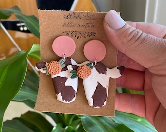 Cow Polymer Clay Earrings | Jewelry, Cows, Cow print, earrings, clay earrings, handmade, gift ideas, floral, flowers, cows and flowers