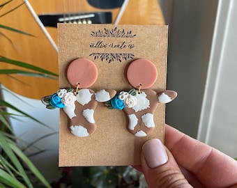 Cow Polymer Clay Earrings | Jewelry, Cows, Cow print, earrings, clay earrings, handmade, gift ideas, floral, flowers, cows and flowers