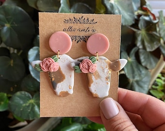 Cow Polymer Clay Earrings | Jewelry, Cows, Cow print, earrings, clay earrings, handmade, gift ideas, floral, flowers, cows and flowers
