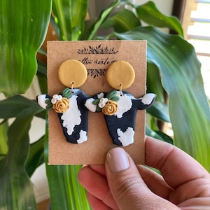 Cow Polymer Clay Earrings | Jewelry, Cows, Cow print, earrings, clay earrings, handmade, gift ideas, floral, flowers, cows and flowers