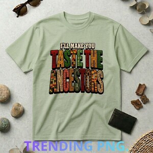 Peut inclure: T-shirt vert clair avec l'inscription "I'll Make You Taste The Ancestors" en lettres colorées et à motifs. Le t-shirt est en matière douce et convient aux tenues décontractées.