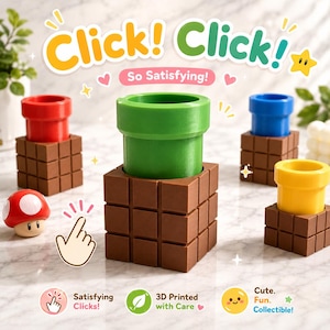 May include: A set of four cylindrical pipes in red, green, blue, and yellow, each mounted on a brown block base with a grid pattern. A small red and white mushroom figure sits nearby. Text includes Click! Click! So Satisfying! and 3D Printed with Care.