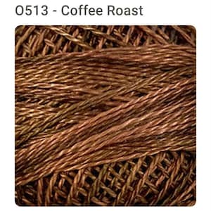 May include: Close-up of a skein of embroidery floss in shades of brown and green. The floss is tightly twisted, creating a textured appearance. The text "0513 - Coffee Roast" is at the top of the image.