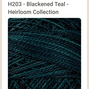 May include: Teal blue yarn with a slightly textured surface.  H203 - Blackened Teal - Heirloom Collection