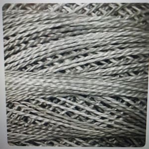 May include: Close-up of a gray yarn with a textured, woven pattern.