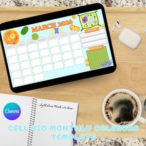 May include: A digital calendar for March 2026, with cell biology illustrations, on a black tablet. A notebook with "Canva" branding and the text "CELL BIO MONTHLY CALENDAR TEMPLATE" is also present, alongside a coffee cup and wireless earbuds.