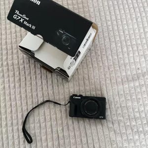 May include: A rectangular wooden sign, distressed for a rustic look, bearing the handwritten text "Welcome to our home". The sign is designed for welcoming guests and is suitable for display indoors or outdoors.