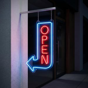 May include: A neon sign with the word "OPEN" in red letters, outlined in blue, and an arrow pointing left. The sign hangs from a metal bracket and chains, mounted on a wall next to a glass door.