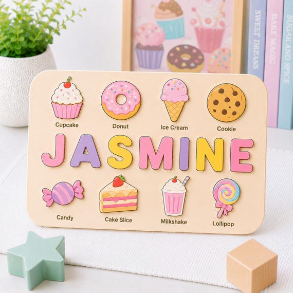 A wooden name puzzle shaped like desserts and sweet treats is a genuinely charming, handmade early-learning toy that doubles as nursery decor — the dessert theme makes it stand out from standard letter puzzles.