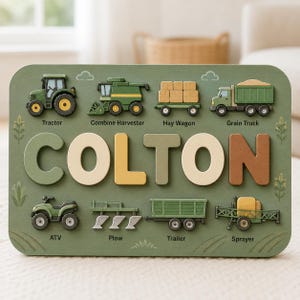May include: A rectangular wooden puzzle board in sage green featuring the name COLTON in large, multi-colored 3D letters. The board displays illustrations of farm equipment including a tractor, combine harvester, hay wagon, grain truck, ATV, plow, trailer, and sprayer, each labeled with its corresponding name.
