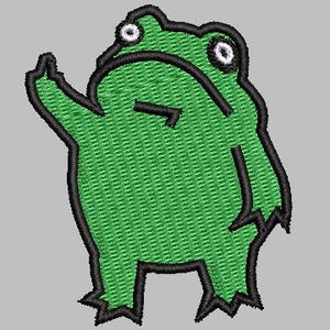 May include: Embroidered patch featuring a green frog with black outlines. The frog is depicted with a raised arm and a slightly grumpy expression. The patch has a textured appearance, suggesting it is made of fabric.