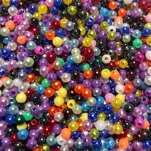 May include: A large assortment of colorful plastic beads. The beads are round and have a pearlescent finish. They are perfect for crafting projects.