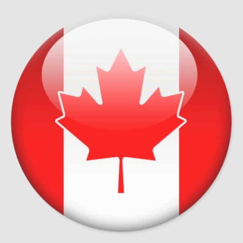 May include: A round button with a glossy finish features the Canadian flag. The flag is red and white with a large red maple leaf in the center.