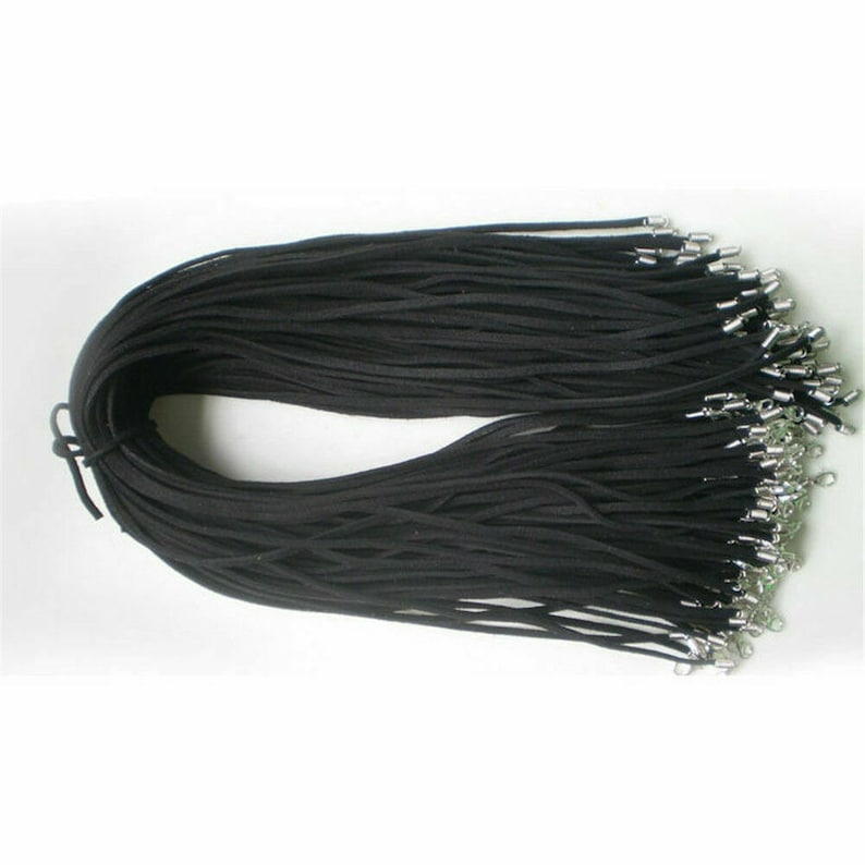 May include: A bulk pack of black suede cord with silver lobster clasps. The cords are bundled together and ready to be used for jewelry making.
