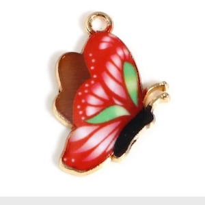 Red Butterfly charm. enamel with green and white detailed pattern, gold plated charm