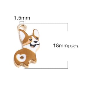 May include: Gold-tone metal charm featuring a cartoon corgi dog with brown and white fur. The charm is 18mm (6/8") long and 1.5mm wide.