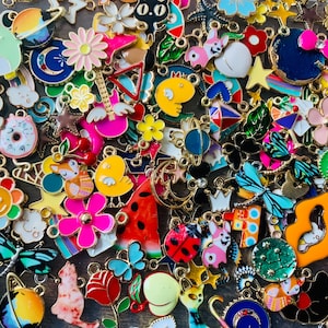 Mixed enamel charms, assorted bulk styles in a mix of colors and styles, new pieces added weekly