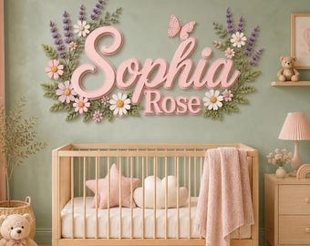 May include: A wall-mounted sign featuring the name Sophia Rose in raised pink lettering, surrounded by decorative lavender sprigs, white and pink flowers, and a small pink butterfly, positioned above a wooden crib with a pink blanket.