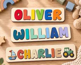 May include: Three rectangular wooden name puzzles featuring colorful, chunky letters. The top puzzle spells OLIVER in primary colors, the middle spells WILLIAM in shades of blue and purple, and the bottom spells CHARLIE with a sailboat and tractor icon.