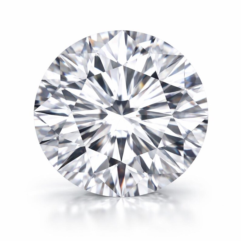 May include: A round brilliant cut gemstone with a clear, colorless appearance. The stone features numerous triangular and kite-shaped facets arranged in a symmetrical pattern, creating a high level of light reflection and internal sparkle.