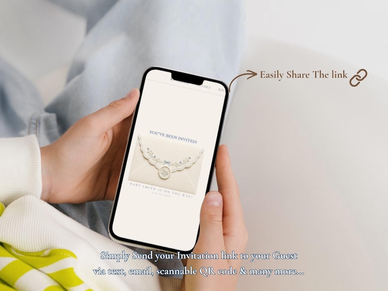 May include: A smartphone displaying a digital baby shower invitation featuring a cream-colored envelope with floral lace trim and a wax seal. The screen shows the text 'YOU'VE BEEN INVITED' and 'BABY SMITH IS ON THE WAY'. Includes the text 'Easily Share The link'.