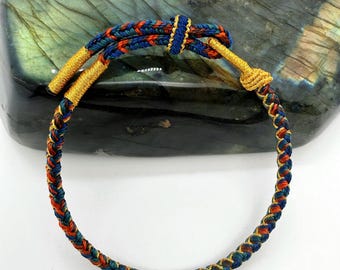 Braccialetto intrecciato tibetano: tessuto a mano, nodo portafortuna, gioiello spirituale, gioiello da meditazione