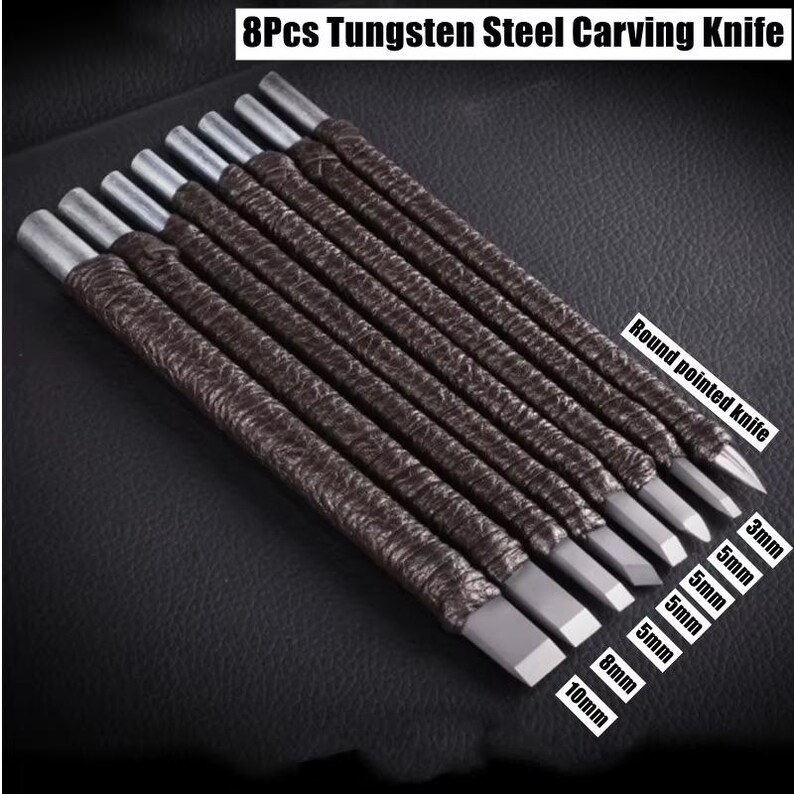 May include: Set of eight tungsten steel carving knives. Each knife has a silver blade and a brown, textured handle. The blades vary in size, with labels indicating measurements from 3mm to 10mm. The text "Round pointed knife" is also visible.