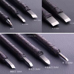 May include: Close-up of a set of wood carving tools with black leather-wrapped handles and silver blades. The tools include flat, angled, and rounded blades, with sizes ranging from 2mm to 10mm. The text "FNICEL" is visible.