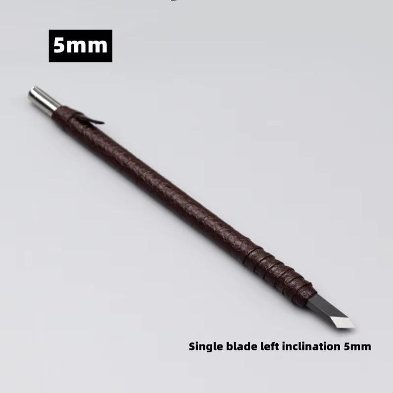 May include: A brown-handled carving tool with a silver tip and a single blade. The text "5mm" is in a black box at the top, and "Single blade left inclination 5mm" is at the bottom.