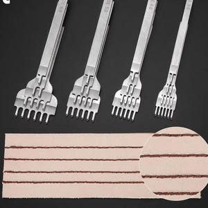 May include: Four silver leathercraft tools with varying prong counts, labeled 6.0, 5.0, 4.0, and 3.0. Below, a piece of light brown leather shows evenly spaced, stitched lines, with a close-up of the stitching in the lower right corner. The tools are for leatherworking.