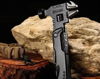 May include: A multi-function wrench hammer tool made of stainless steel. The tool has a hammer head, adjustable wrench, and other folding tools. The text "Multi-Function Wrench Hammer" is at the top of the image.