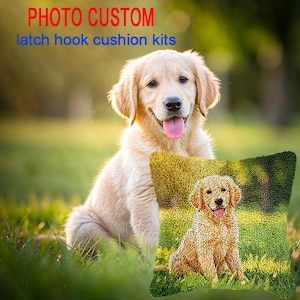 May include: A square latch hook cushion kit featuring a golden retriever puppy sitting in green grass. The text PHOTO CUSTOM latch hook cushion kits is displayed at the top. The cushion cover displays a textured, yarn-based image of the same dog.
