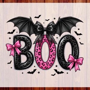 May include: A graphic design featuring the word BOO in large, rounded letters with a black and pink leopard print pattern. A large black lace bow sits above the letters, flanked by two black bat wings. Small pink bows and black bats surround the text.