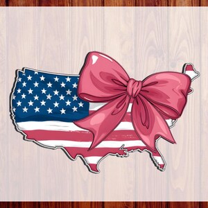 May include: A graphic design featuring the map of the United States filled with the American flag pattern, including a large, prominent pink bow centered over the map. The text CUSTOM DTF and READY TO PRESS is visible on the left and right sides.