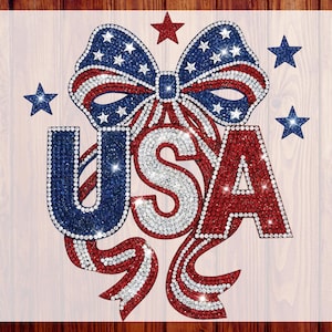 May include: A patriotic design featuring the letters "USA" in red, white, and blue rhinestones. A bow with stars and stripes sits above the letters, with additional stars scattered around. The words "CUSTOM DTF" and "READY TO PRESS" are printed on the sides.