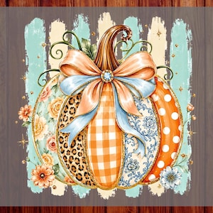 May include: A decorative pumpkin graphic featuring a large peach-coloured bow at the top. The pumpkin segments display various patterns including leopard print, orange gingham, blue floral, and white polka dots on orange. Text reads CUSTOM DTF READY TO PRESS.