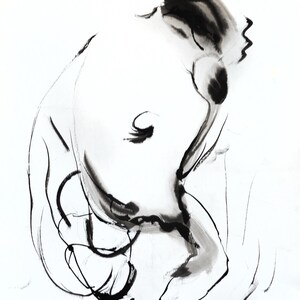 May include: A white ceramic mug with a black handle and the text "But First, Coffee" in a black, bold font. The mug is on a white surface.