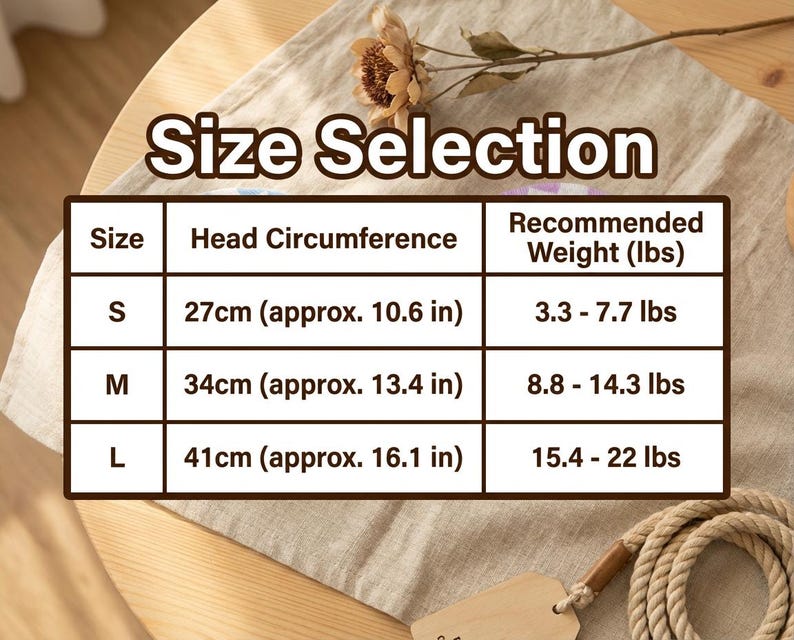 以下が含まれることがあります： 「Size Selection」の文字が上部にあるサイズ選択表。サイズS、M、Lの頭囲をセンチメートル（おおよそのインチ）と推奨体重をポンドで表示。表は明るい色の表面にあります。