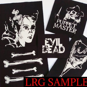 May include: A collection of black patches with white graphic designs. The patches feature images of classic horror movie characters, the words "EVIL DEAD", and bone illustrations. The text "PUPPET MASTER" is also visible.