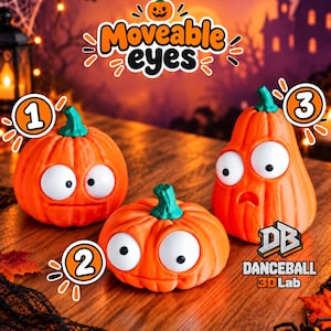 Può includere: Tre figure a forma di zucca arancione con piccioli verdi e grandi occhi bianchi mobili. Le figure sono etichettate con 1, 2 e 3. Il testo "Moveable eyes" appare in alto e il logo "DB DANCEBALL 3D Lab" è visibile nell'angolo in basso a destra.
