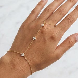 May include: A set of three ceramic mugs with a speckled, matte finish. Each mug is a different colour: light blue, cream, and grey. The mugs have a simple, modern design and a comfortable handle.