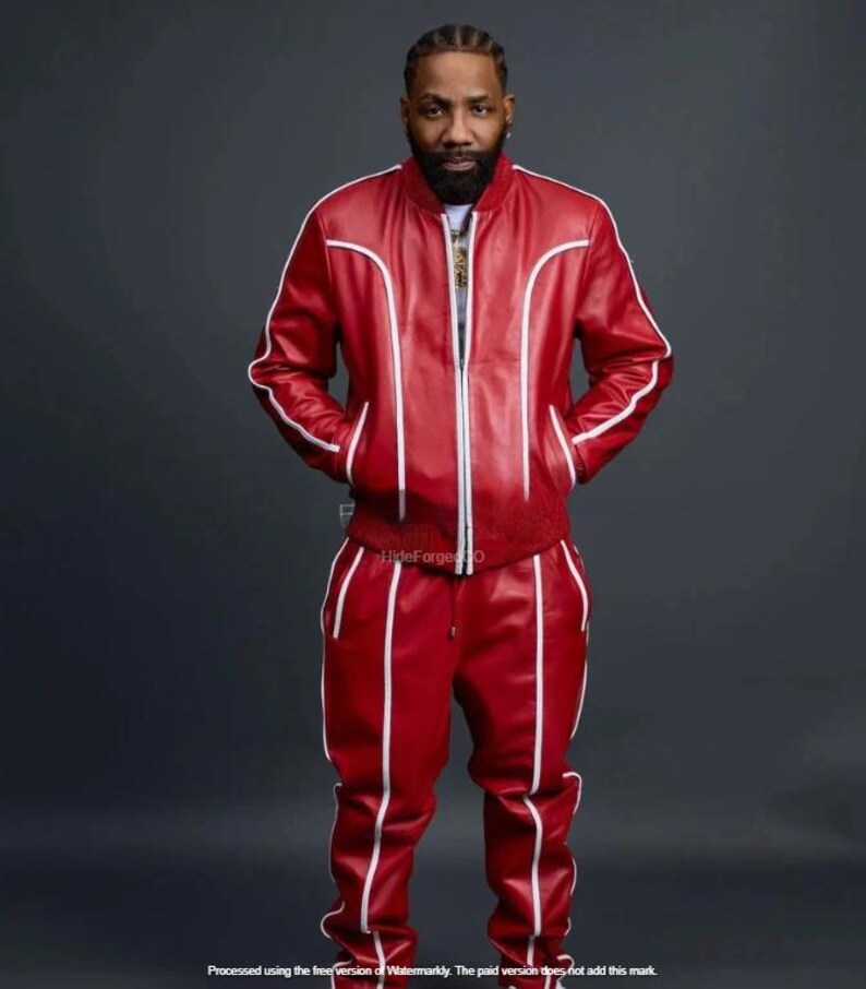 May include: Red leather tracksuit with white piping. The jacket features a zip, and the trousers have a drawstring. This striking outfit is a bold fashion statement.