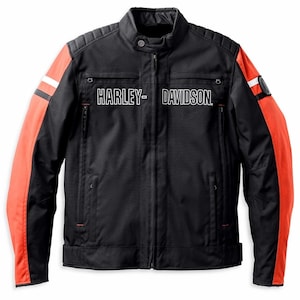 May include: Black motorcycle jacket with orange sleeves and white stripes. The jacket features the Harley-Davidson logo in white across the chest. It has a stand-up collar, a zipper closure, and two front pockets.
