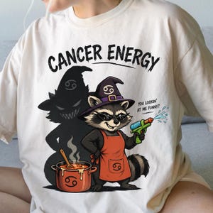 Cancer Energy Water Gun Cancerian Raccoon Witch With Sunglasses Cooking Chaos Funny Zodiac Shirt