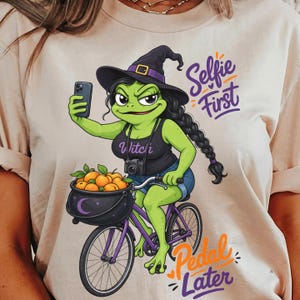 Funny Witch Frog Women Selfie First Pedal Later With Witch Hat and Apricot Pot Cycling Graphic Unique Design Comfort Colors Gift Shirt ,