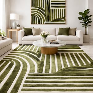 Pode incluir: Sala de estar moderna com sofá branco, almofadas verde-oliva e mesa de centro redonda. O tapete com padrões verdes e brancos e uma grande pintura abstrata completam o conjunto, criando um ambiente harmonioso.