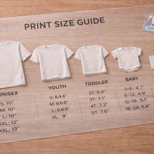 May include: A clear print size guide displays white t-shirts in various sizes: unisex, youth, toddler, baby, and a pocket. Measurements are provided in inches for each size, including S, M, L, XL, XXL, and XXXL.