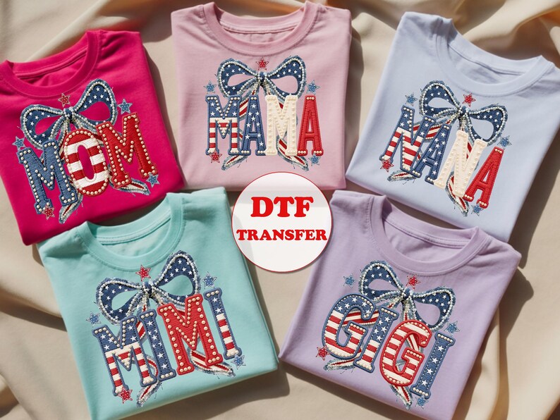 May include: Five colorful t-shirts with patriotic designs. Each shirt features a bow and a different name: MOM, MAMA, NANA, MIMI, and GIGI, in red, white, and blue. The shirts are in shades of pink, blue, and purple, perfect for family.